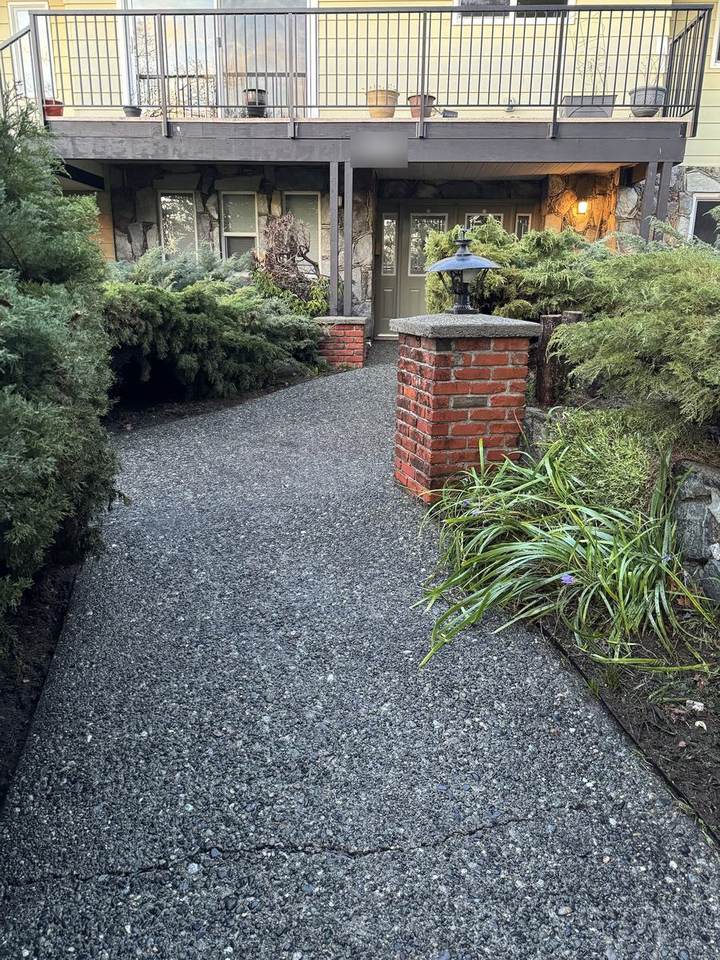 Exposed aggregate front walk after pressure washing