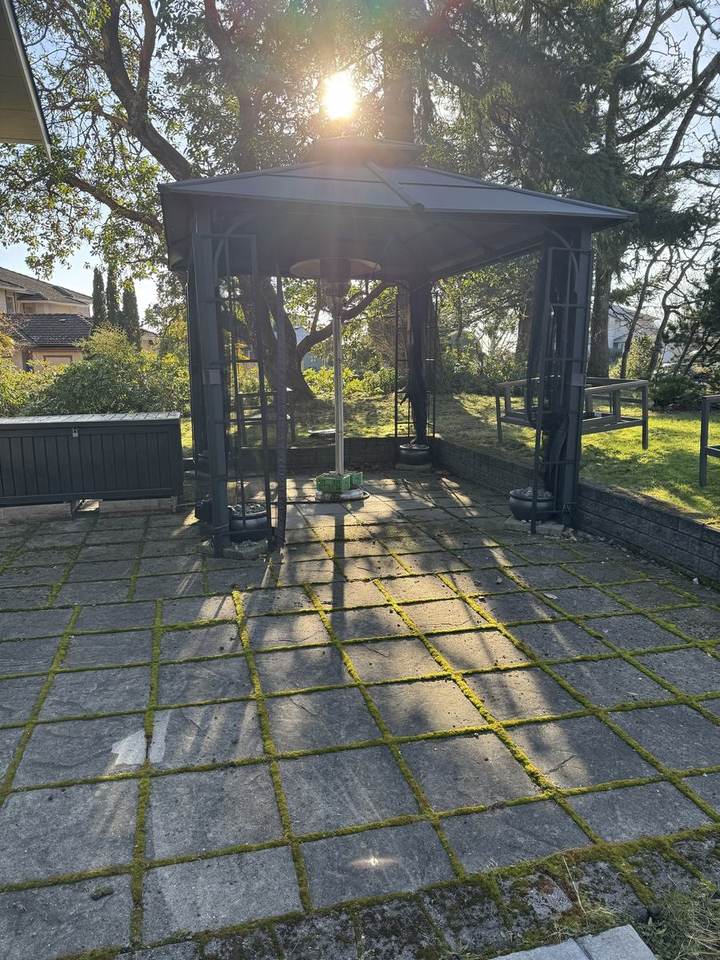 Paver patio under the gazebo before pressure washing